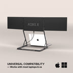 A black AERIS X laptop stand with a silver aluminum frame, shown holding a white laptop on a light beige background. Text at the bottom reads 'UNIVERSAL COMPATIBILITY — Works with most laptops & os' with Apple and Windows logos.