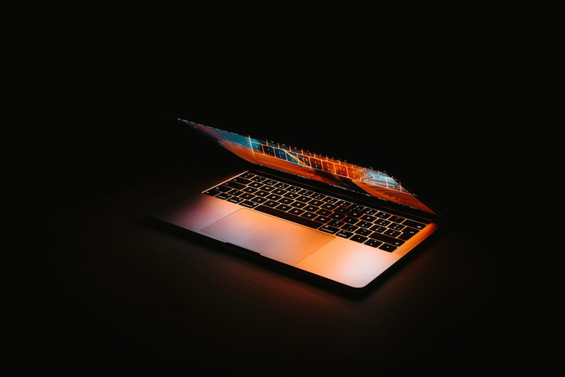 Laptop glowing hot in the dark from blocked airflow